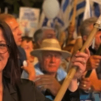 Galit Distel Atbaryan, a member of the Israeli Knesset for the ruling Likud Party, is seen holding an Israeli flag. (Photo: Galit Distel Atbaryan/Facebook)